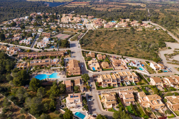 a panoramic shot of a coastal town under blue skies
